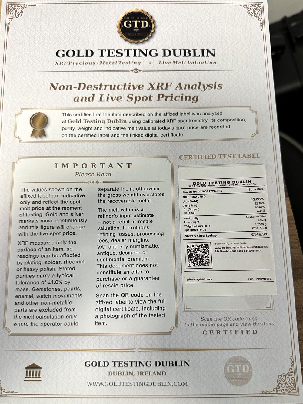 Printed Gold Testing Dublin certificate showing the certified test label with XRF readings, gold purity, live melt value and a QR code